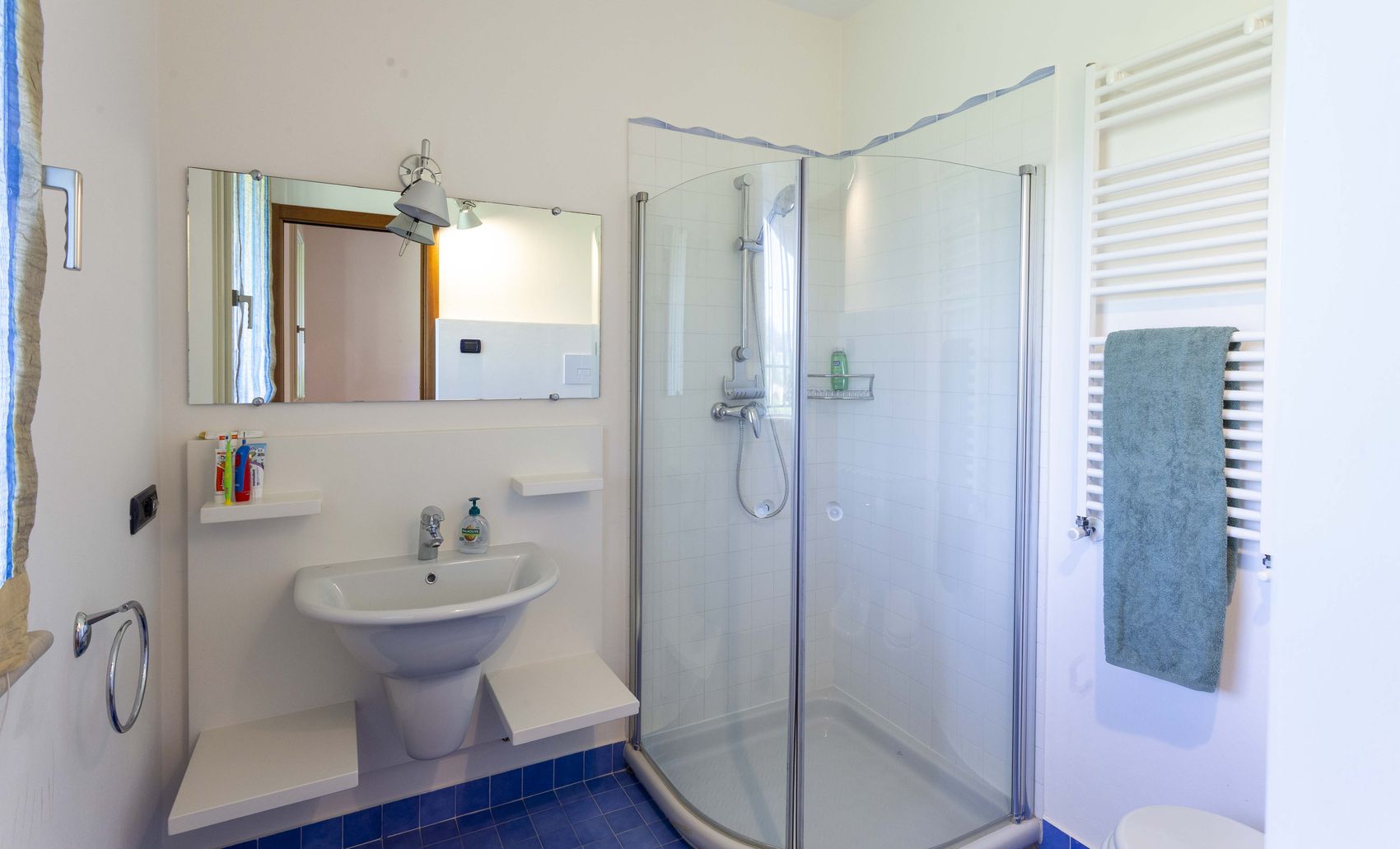 The children's bathroom with a glass shower cubicle