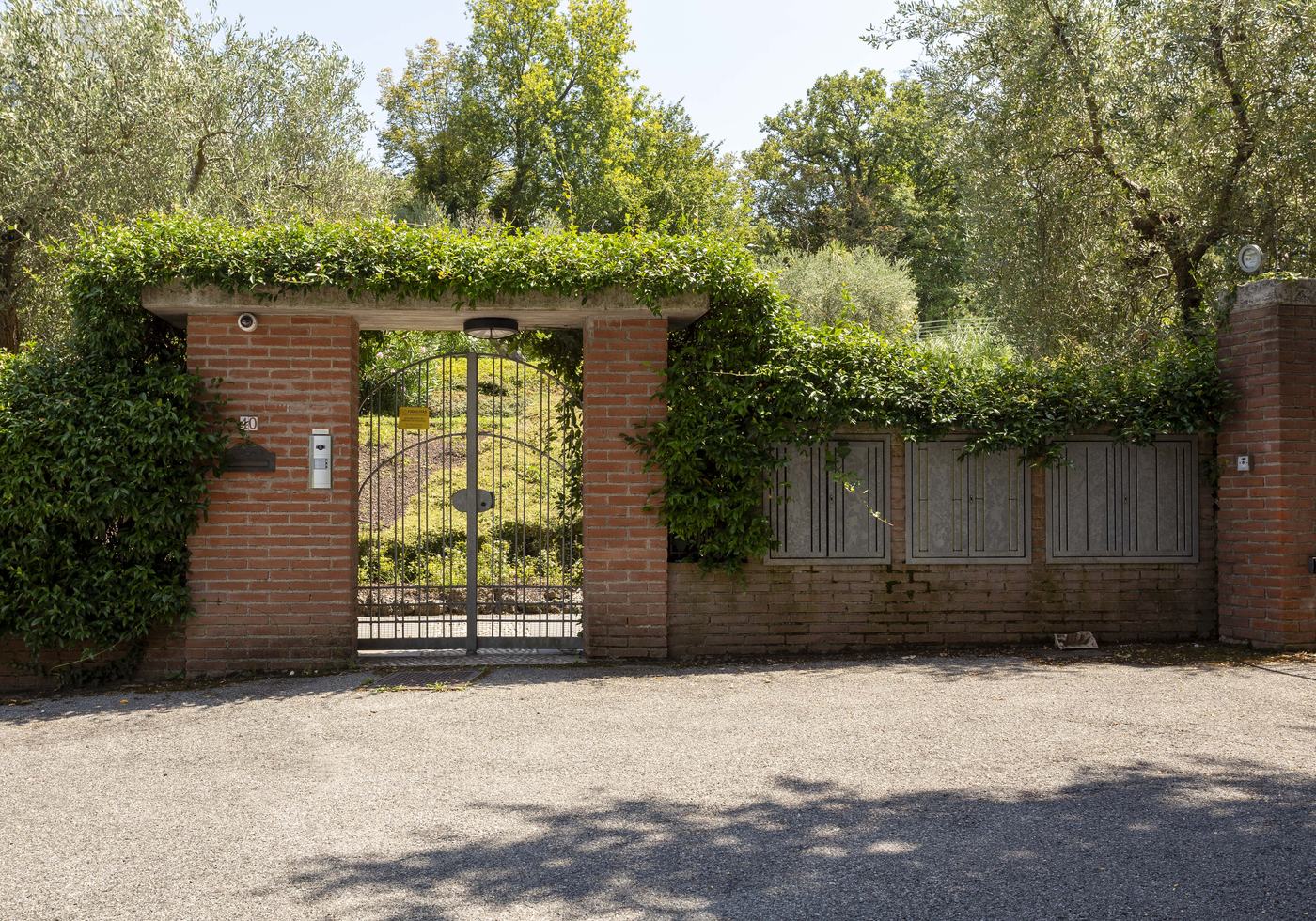 The gated entrance to the property from the road