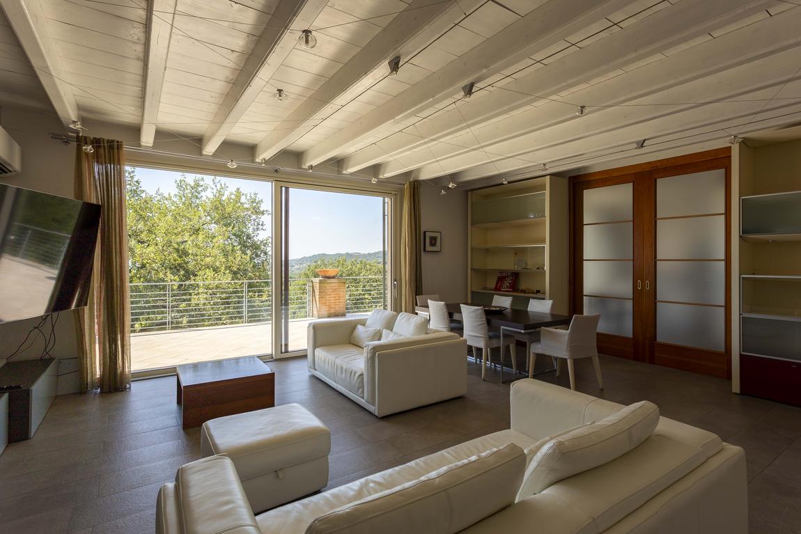 The second living room with shelving and its own dining table
