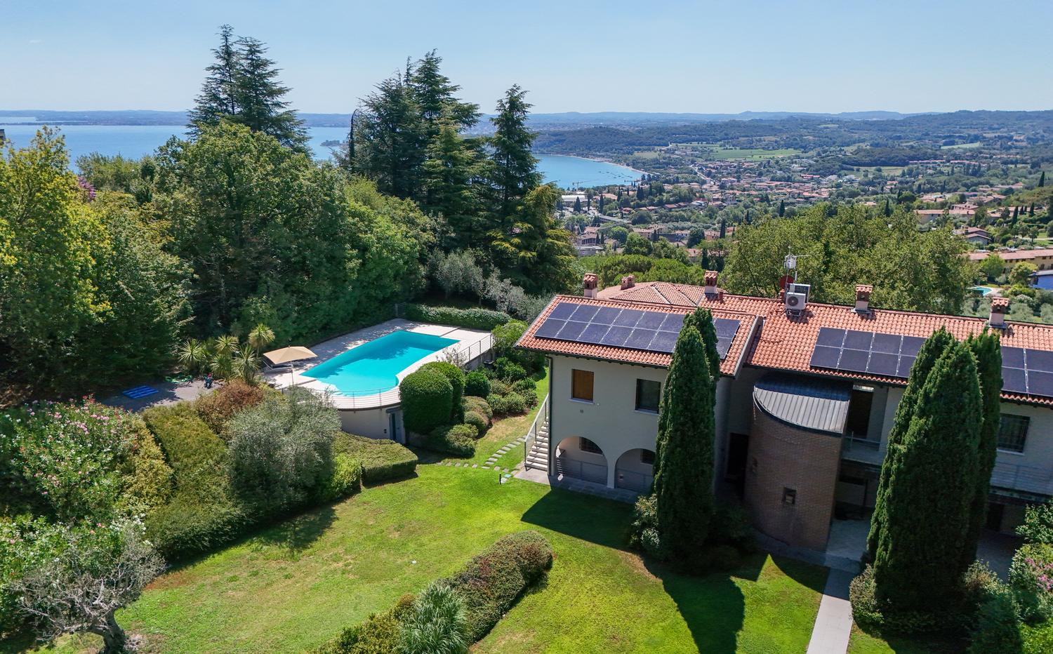 The pool, the house and the lake beyond